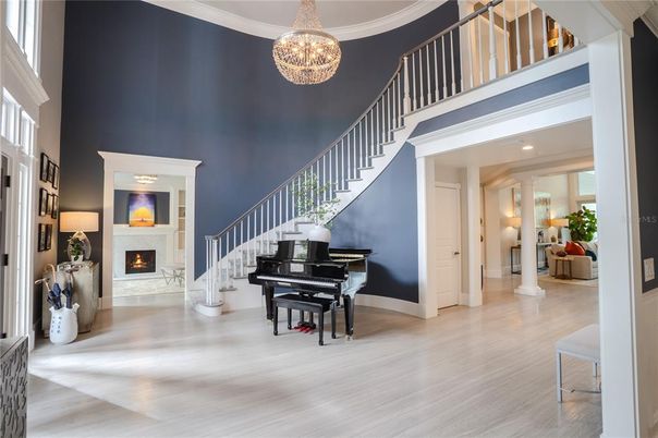 Chandelier, Fireplace, Interior, Piano, Recessed Lighting, Wood Texture Flooring