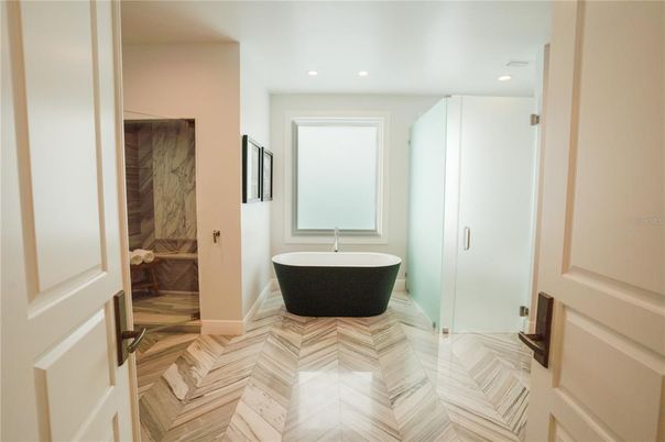 Bathroom, Free Standing Baths, Glass Shower, Interior, Marble, Recessed Lighting, Wood Texture Flooring