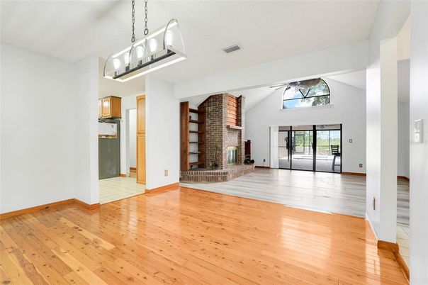 Empty room, Fireplace, Interior, Pendant Lights, Stone Walls, Wood Texture Flooring