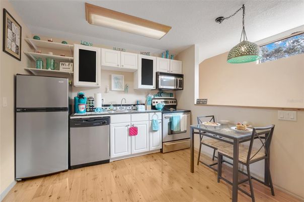 Dining room, Interior, Kitchen, Pendant Lights, Stainless Steel Appliances, Wood Texture Flooring