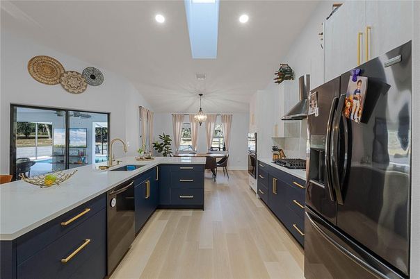 Dining room, Interior, Kitchen, Pendant Lights, Recessed Lighting, Stainless Steel Appliances, Wood Texture Flooring