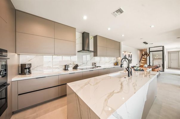 Interior, Kitchen, Marble Walls, Pendant Lights, Recessed Lighting, Stainless Steel Appliances