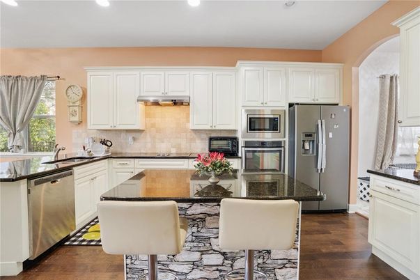 Dining room, Interior, Kitchen, Recessed Lighting, Stainless Steel Appliances, Wood Texture Flooring