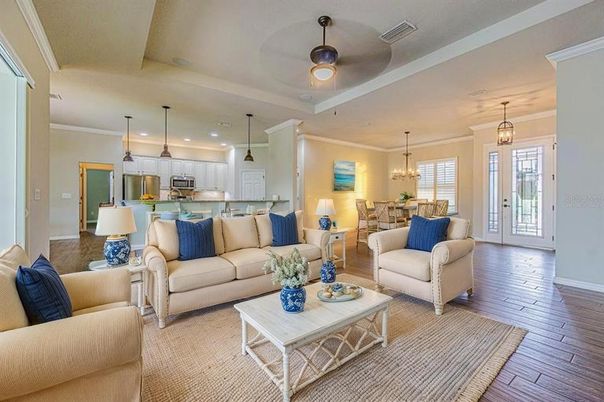 Chandelier, Dining room, Interior, Kitchen, Living room, Pendant Lights, Recessed Lighting, Stainless Steel Appliances, Wood Texture Flooring