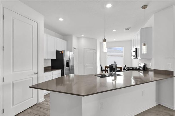 Dining room, Interior, Kitchen, Pendant Lights, Recessed Lighting, Stainless Steel Appliances, Wood Texture Flooring