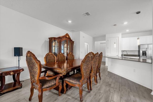 Dining room, Interior, Kitchen, Pendant Lights, Recessed Lighting, Stainless Steel Appliances, Wood Texture Flooring
