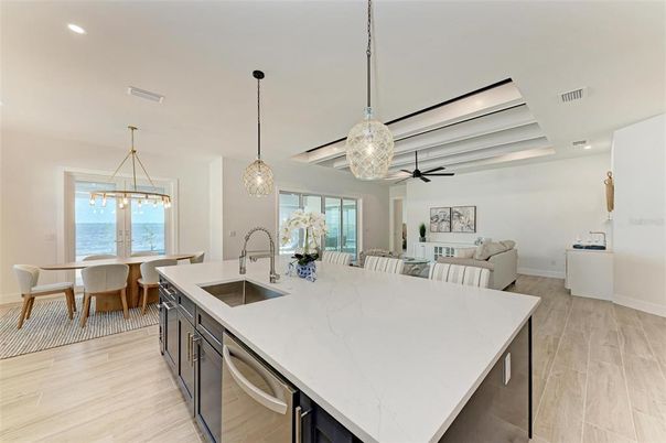 Dining room, Interior, Kitchen, Living room, Pendant Lights, Recessed Lighting, Water, Wood Texture Flooring