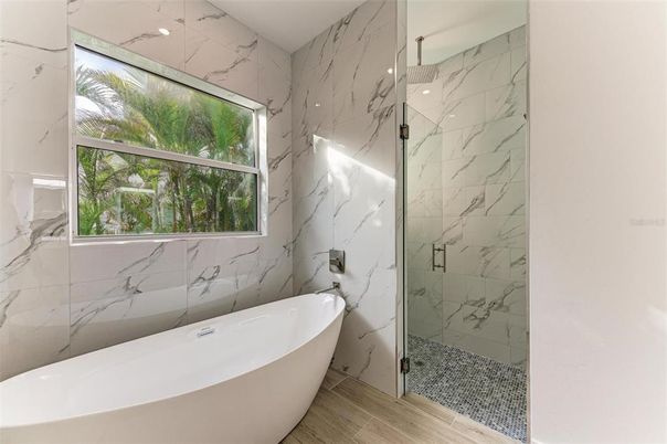 Bathroom, Free Standing Baths, Glass Shower, Interior, Marble Walls, Wood Texture Flooring