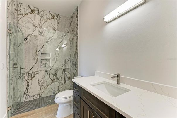 Bathroom, Glass Shower, Interior, Marble Walls, Wood Texture Flooring