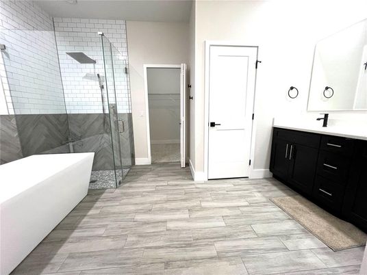 Bathroom, Free Standing Baths, Glass Shower, Interior, Marble Walls, Wood Texture Flooring