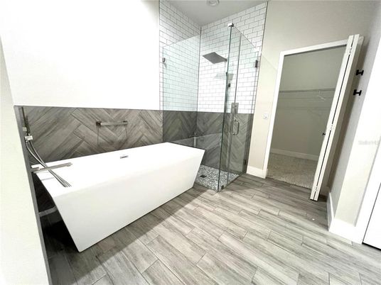 Bathroom, Free Standing Baths, Glass Shower, Interior, Wood Texture Flooring