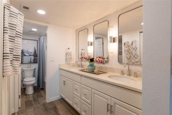 Bathroom, Dual Sink Vanities, Interior, Recessed Lighting, Wood Texture Flooring