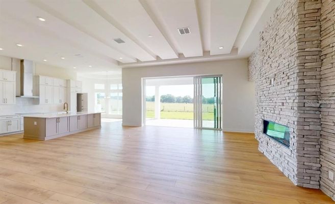 Fireplace, Interior, Kitchen, Recessed Lighting, Stone Walls, Wood Texture Flooring