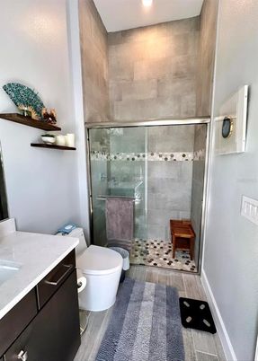 Bathroom, Glass Shower, Interior, Recessed Lighting, Wood Texture Flooring