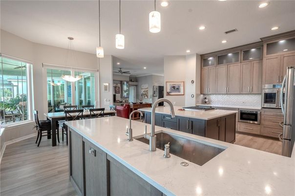 Dining room, Interior, Kitchen, Pendant Lights, Recessed Lighting, Stainless Steel Appliances, Wood Texture Flooring