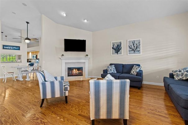 Dining room, Fireplace, Interior, Living room, Recessed Lighting, Wood Texture Flooring