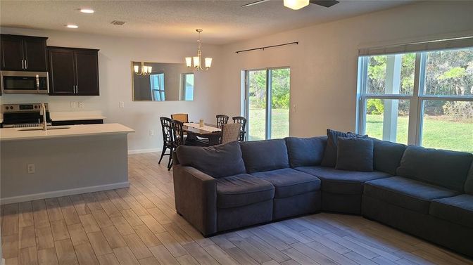 Chandelier, Dining room, Interior, Kitchen, Living room, Recessed Lighting, Wood Texture Flooring