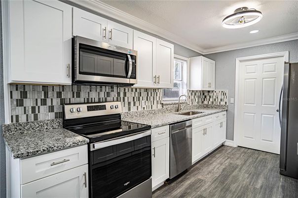 Interior, Kitchen, Recessed Lighting, Stainless Steel Appliances, Wood Texture Flooring