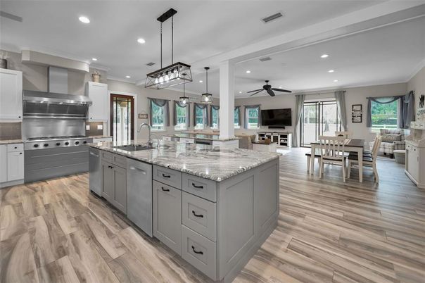 Dining room, Interior, Kitchen, Pendant Lights, Recessed Lighting, Stainless Steel Appliances, Wood Texture Flooring