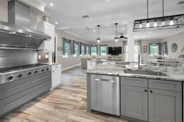 Dining room, Interior, Kitchen, Pendant Lights, Recessed Lighting, Stainless Steel Appliances, Wood Texture Flooring