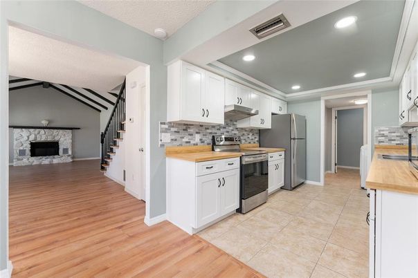 Fireplace, Interior, Kitchen, Recessed Lighting, Stone Walls, Wood Texture Flooring