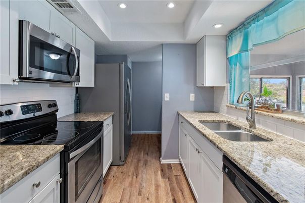Interior, Kitchen, Recessed Lighting, Stainless Steel Appliances, Wood Texture Flooring