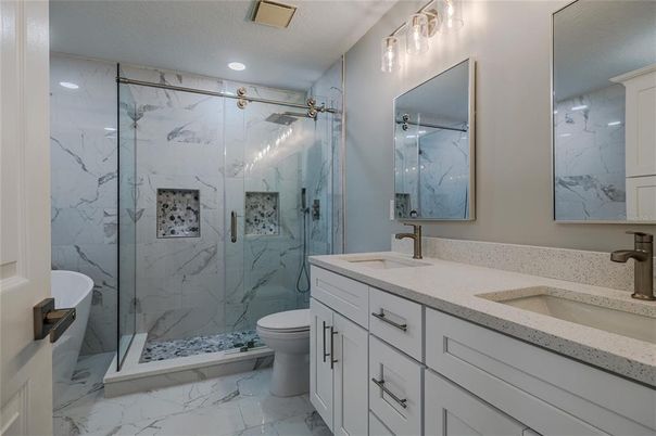 Bathroom, Dual Sink Vanities, Glass Shower, Interior, Marble, Marble Walls, Recessed Lighting