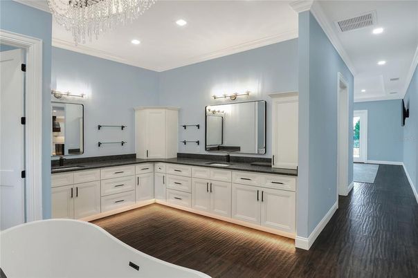Bathroom, Dual Sink Vanities, Free Standing Baths, Interior, Recessed Lighting, Wood Texture Flooring