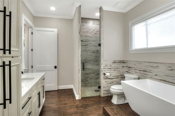 Bathroom, Free Standing Baths, Glass Shower, Interior, Recessed Lighting, Wood Texture Flooring