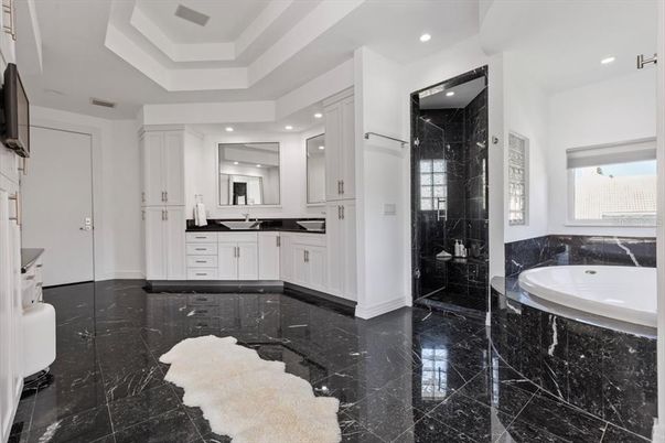 Bathroom, Dual Sink Vanities, Glass Shower, Interior, Marble, Marble Walls, Recessed Lighting