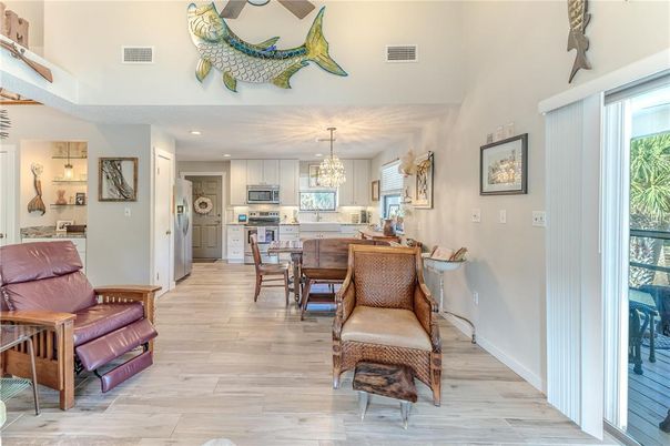 Chandelier, Dining room, Interior, Kitchen, Recessed Lighting, Stainless Steel Appliances, Wood Texture Flooring