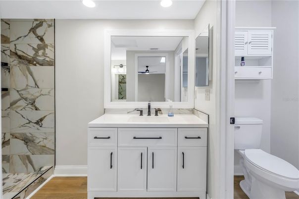 Bathroom, Glass Shower, Interior, Marble Walls, Recessed Lighting, Wood Texture Flooring