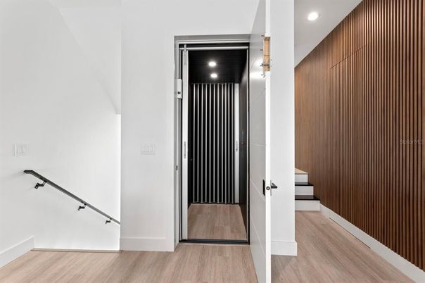 Elevator, Interior, Recessed Lighting, Wood Texture Flooring, Wooden Walls