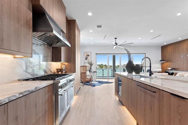 Interior, Kitchen, Marble Walls, Recessed Lighting, Stainless Steel Appliances, Wood Texture Flooring