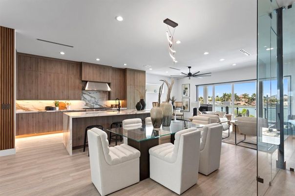 Dining room, Interior, Kitchen, Living room, Marble Walls, Pendant Lights, Recessed Lighting, Stainless Steel Appliances, Wood Texture Flooring