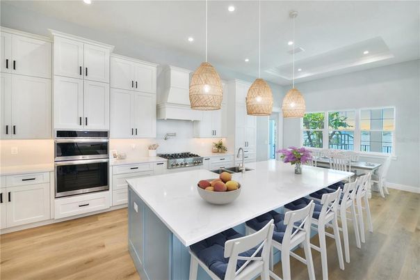 Dining room, Interior, Kitchen, Pendant Lights, Recessed Lighting, Stainless Steel Appliances, Wood Texture Flooring