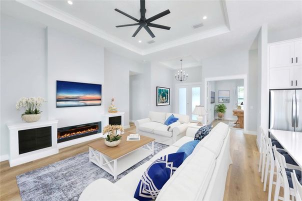 Chandelier, Fireplace, Interior, Living room, Recessed Lighting, Wood Texture Flooring