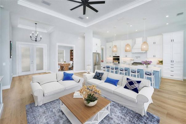 Chandelier, Interior, Kitchen, Living room, Pendant Lights, Recessed Lighting, Stainless Steel Appliances, Wood Texture Flooring
