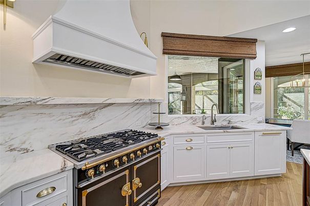 Interior, Kitchen, Marble Walls, Recessed Lighting, Stainless Steel Appliances, Wood Texture Flooring