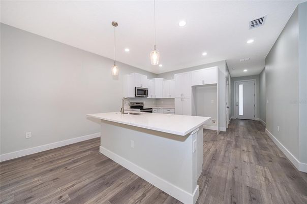 Interior, Kitchen, Pendant Lights, Recessed Lighting, Stainless Steel Appliances, Wood Texture Flooring