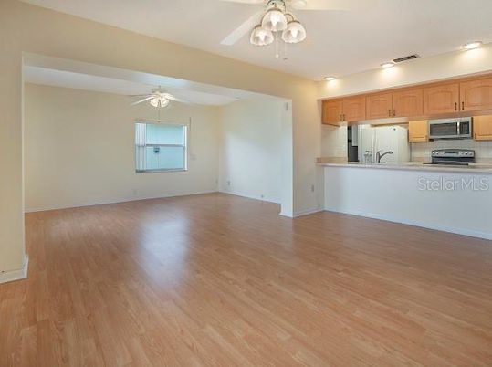 Empty room, Interior, Kitchen, Stainless Steel Appliances, Wood Texture Flooring