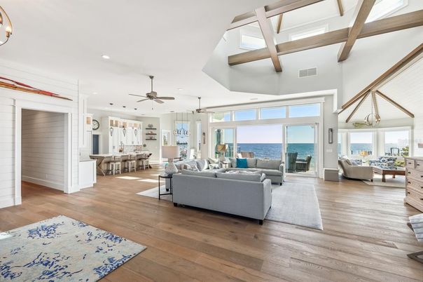 Dining room, Fireplace, Interior, Living room, Pendant Lights, Recessed Lighting, Water, Wooden Beams, Wood Texture Flooring