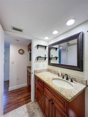 Bathroom, Dual Sink Vanities, Interior, Recessed Lighting, Wood Texture Flooring