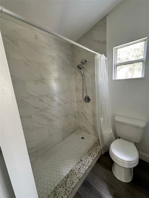 Bathroom, Glass Shower, Interior, Marble Walls, Wood Texture Flooring
