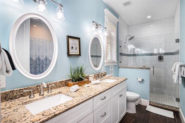 Bathroom, Dual Sink Vanities, Glass Shower, Interior, Recessed Lighting, Wood Texture Flooring