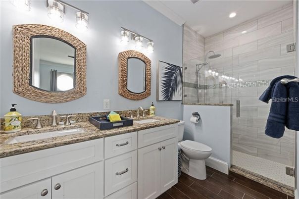 Bathroom, Dual Sink Vanities, Glass Shower, Interior, Recessed Lighting, Wood Texture Flooring