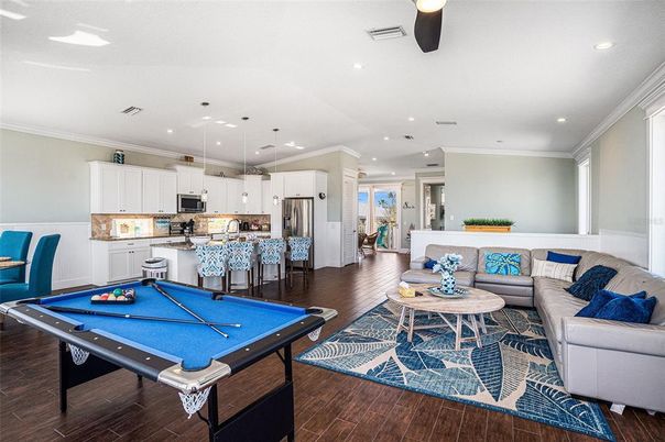 Billiard Table, Game Room, Interior, Kitchen, Living room, Pendant Lights, Recessed Lighting, Stainless Steel Appliances, Wood Texture Flooring