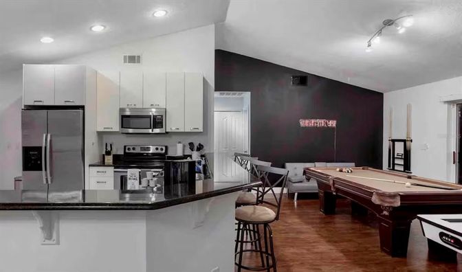 Billiard Table, Dining room, Game Room, Interior, Kitchen, Recessed Lighting, Stainless Steel Appliances, Wood Texture Flooring