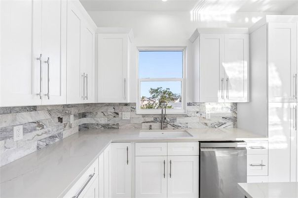 Interior, Kitchen, Marble Walls, Recessed Lighting, Stainless Steel Appliances