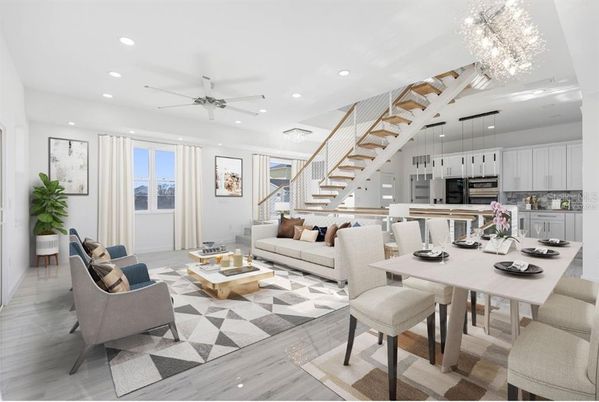 Chandelier, Dining room, Interior, Kitchen, Living room, Pendant Lights, Recessed Lighting, Stainless Steel Appliances, Wood Texture Flooring